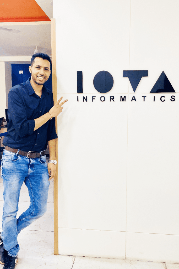 Saket Asati, CEO of IOTA Informatics with company sign